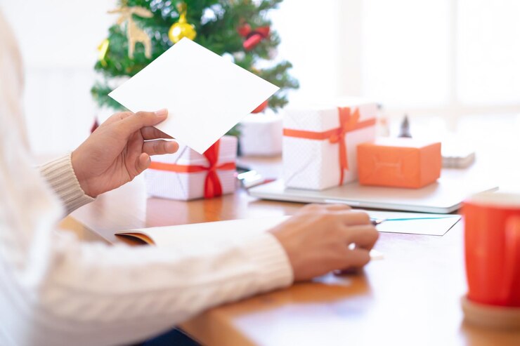 cropped-hand-woman-holding-blank-paper-table-christmas_1048944-9434469 - Champagne Life